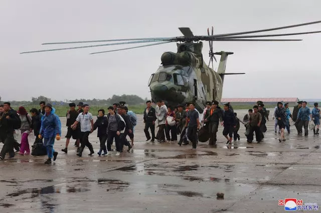 People who were affected by heavy rainfall in North Phyongan province, North Korea are rescued 