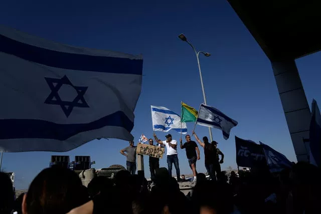 Protesters gather in support of soldiers being questioned for detainee abuse, outside of the Sde Teiman military base in Israel