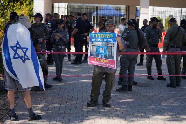 =Right-wing Israelis protest outside of the initial hearing in military court for nine Israeli soldiers over what a defense lawyer said were allegations of sexual abuse of a Palestinian 