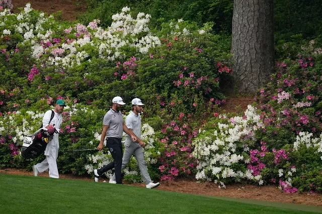 Max Homa, right, and Dustin Johnson walk on the 13th hole during a practice round (AP Photo/George Walker IV)
