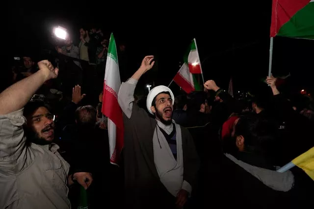 Iranian demonstrators chant slogans during their anti-Israeli gathering in front of the British embassy in Tehran, Iran 