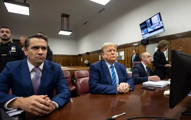 Donald Trump awaits the start of proceedings on the second day of jury selection at Manhattan Criminal Court in New York