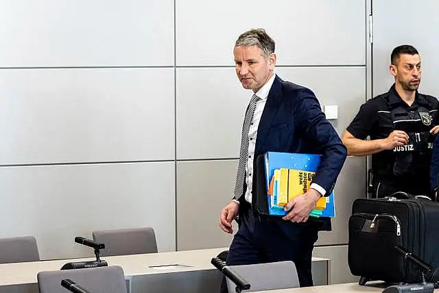 Bjorn Hocke arrives for a session of his trial over the alleged use of Nazi phrases, at the regional court in Halle, eastern Germany 