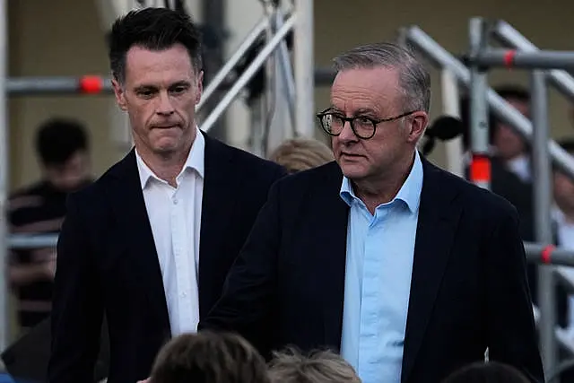 =Australian Prime Minister Anthony Albanese, right, at a candlelight vigil 