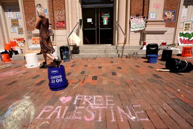 A passer-by walks past an entrance to a building at Rhode Island School of Design