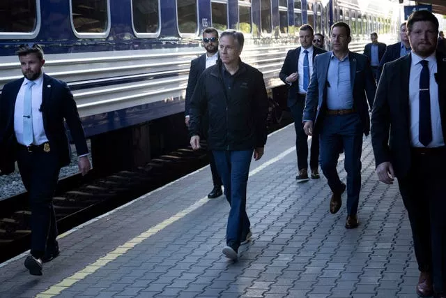 US Secretary of State Antony Blinken walks to board a Ukrainian Railways train at Przemysl Glowny train station while travelling to Kyiv, Ukraine