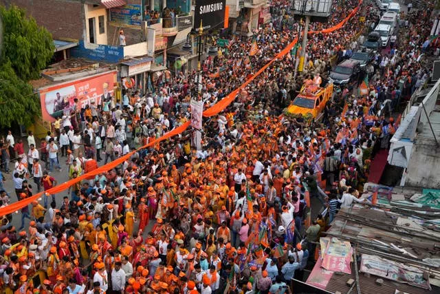 Supporters of Bharatiya Janata Party participate in a roadshow by Indian Prime Minister Narendra Modi in Varanasi 