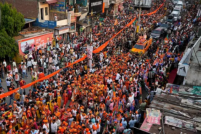 Supporters of Bharatiya Janata Party participate in a roadshow by Indian Prime Minister Narendra Modi in Varanasi 