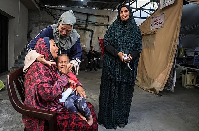 Palestinians mourn their relatives in Rafah, Gaza