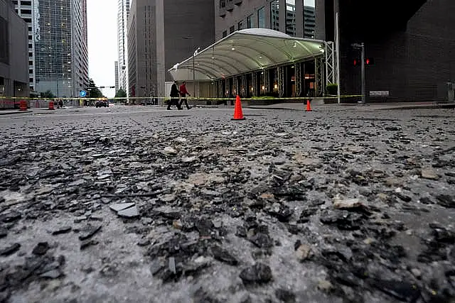 Broken glass covers a street in Houston