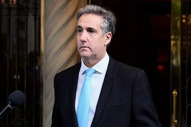 Michael Cohen leaves his apartment building on his way to Manhattan criminal court in New York