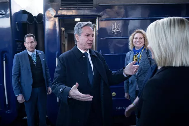 US Secretary of State Antony Blinken is greeted by US Ambassador to Ukraine Bridget Brink after arriving by train at Kyiv-Pasazhyrskyi station