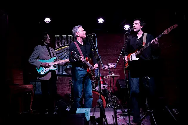 US secretary of state Antony Blinken, centre, performs Rockin’ In The Free World with members of The 1999 band at the Barman Dictat bar in Kyiv