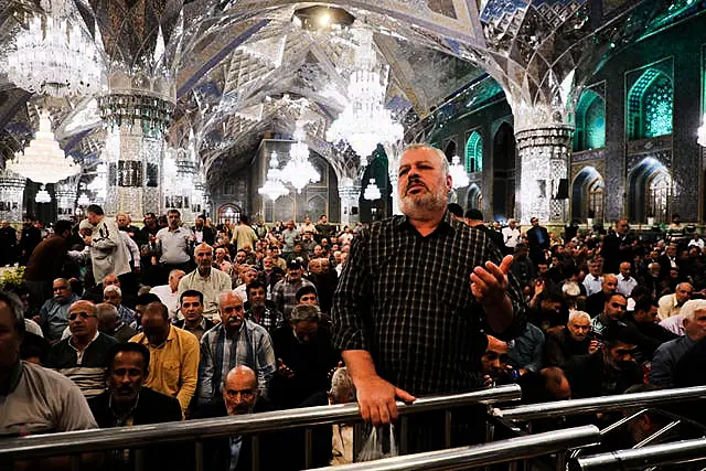 Iranian pilgrims pray for President Ebrahim Raisi at Imam Reza Shrine in the city of Mashhad