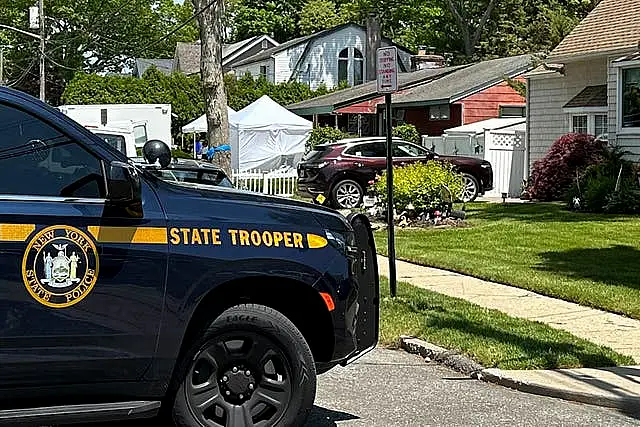 Law enforcement officers at Rex Heuermann’s home