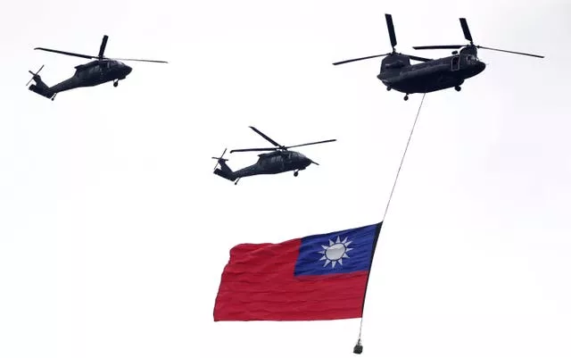 Helicopters carry flag