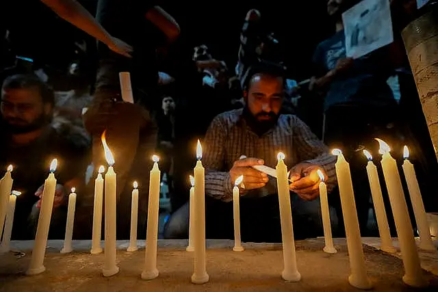 Candles are lit in memory of Mr Raisi and others killed in the helicopter crash