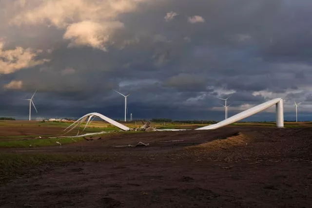 The tornado crumpled massive power-producing wind turbines several miles outside of Greenfield 