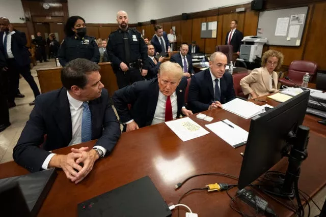 Former US president Donald Trump attends his trial at Manhattan Criminal Court in New York (