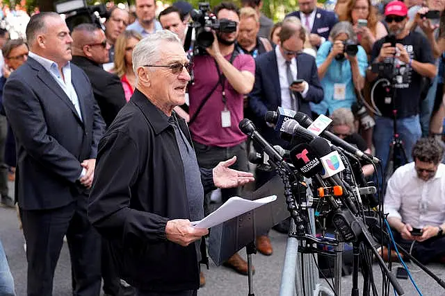 Robert De Niro speaks to reporters in support of President Joe Biden across the street from former president Donald Trump’s criminal trial in New York