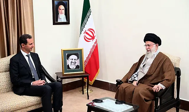 Bashar Assad and Ayatollah Ali Khamenei, both seated