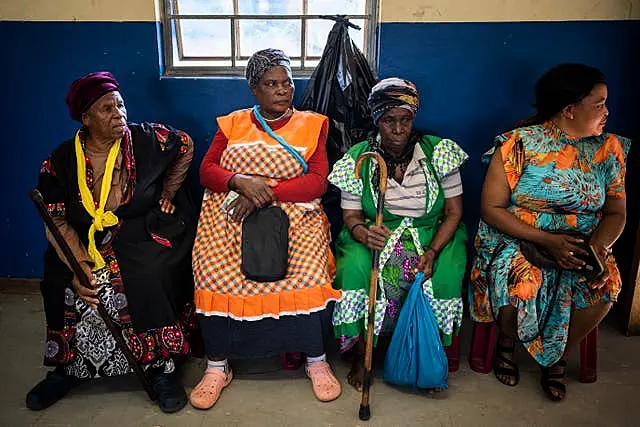 Women wait to cast their ballots during general elections in Nkandla, Kwazulu Natal, South Africa