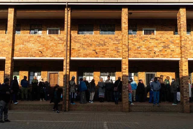 Voters line up to cast their ballot in general elections in Soweto, South Africa