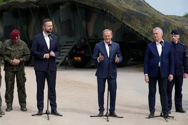 Poland’s Prime Minister Donald Tusk, Defence Minister Wladyslaw Kosiniak-Kamysz and Interior Minister Tomasz Siemoniak