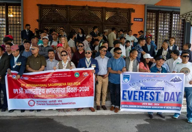 People from the mountaineering community gather to participate a rally to mark the anniversary of the first ascent of Mount Everest in Kathmandu, Nepal