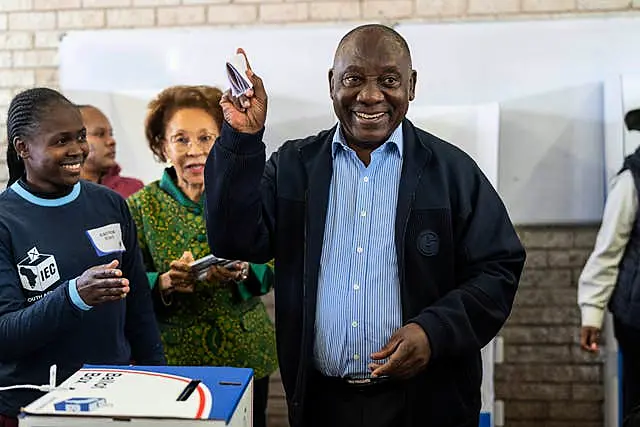 South African President Cyril Ramaphosa casts his ballot for the general elections in Soweto, South Africa