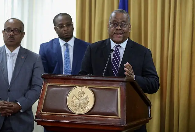 Garry Conille speaks to the press after his swearing-in ceremony