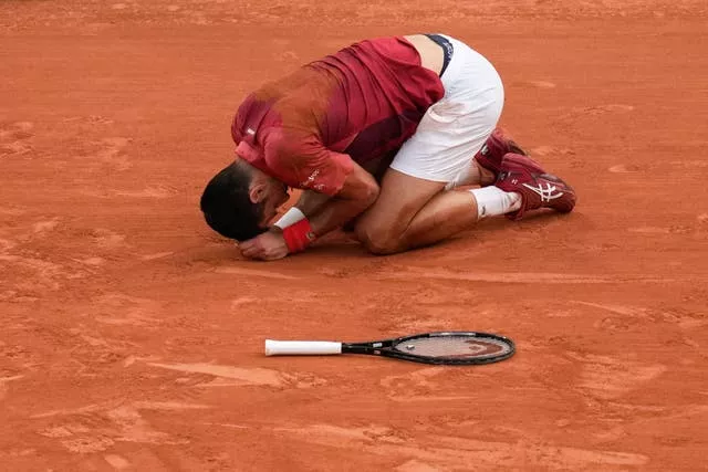 Novak Djokovic goes down injured during his win over Francisco Cherundolo