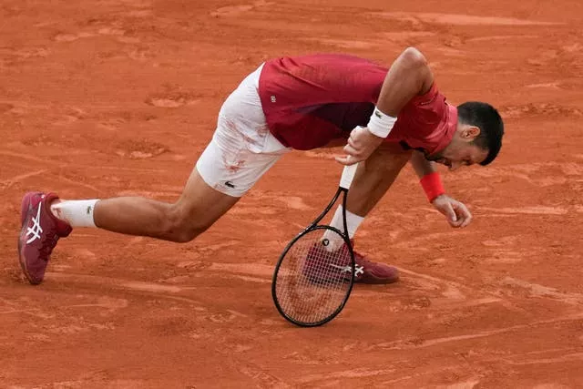 Novak Djokovic slips in action at the French Open