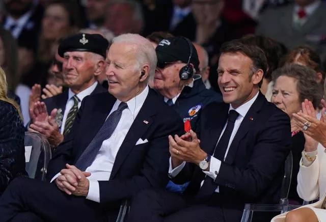 Biden and Macron applaud during D-Day commemorations