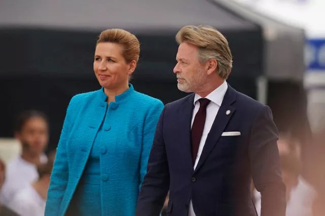 Danish Premier Mette Frederiksen and her husband Bo Tengberg arrive at the official international ceremony to mark the 80th anniversary of D-Day 