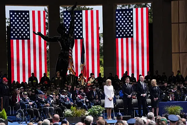 Emmanuel Macron, his wife Brigitte and US President Joe Biden attend a ceremony at a US cemetery near Colleville-sur-Mer