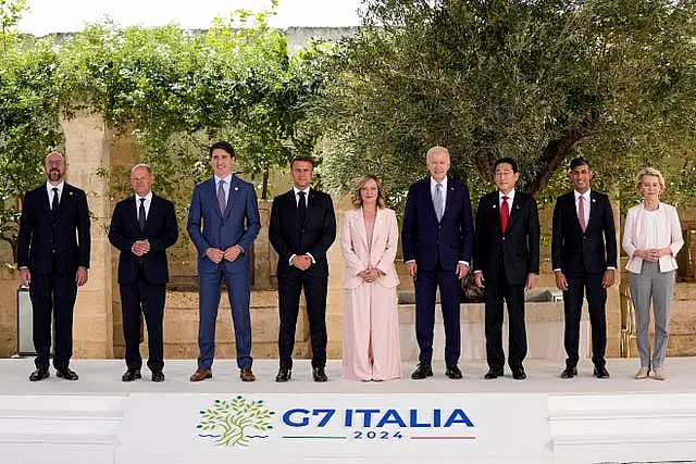 G7 leaders line up for a photo at the summit