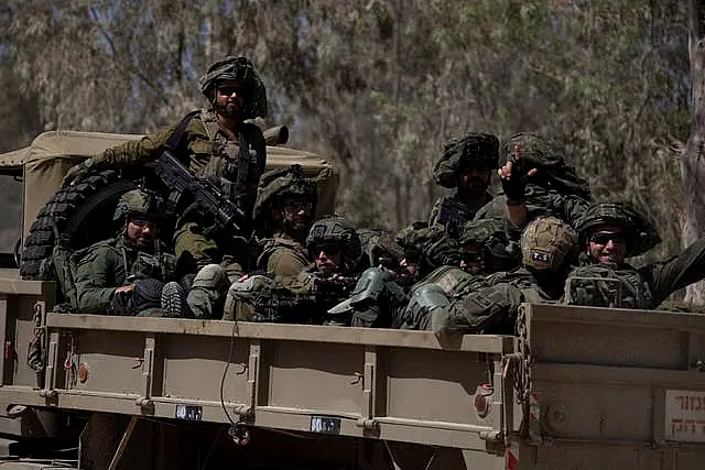 Israeli soldiers on the back of a truck