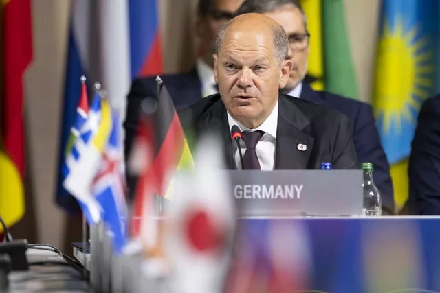 Germany’s Chancellor Olaf Scholz speaks during the opening plenary session of the Summit on Peace in Ukraine, in Obburgen, Switzerland