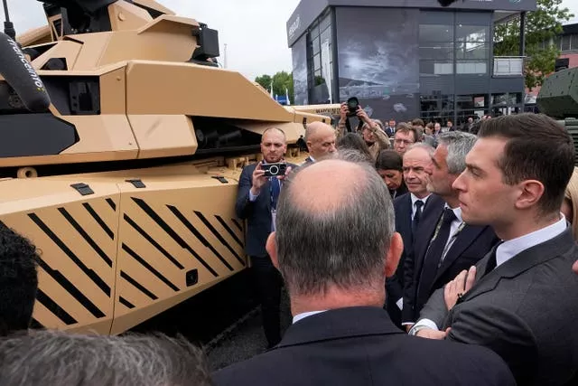 Mr Bardella looks at a Leclerc Evolution battle tank 