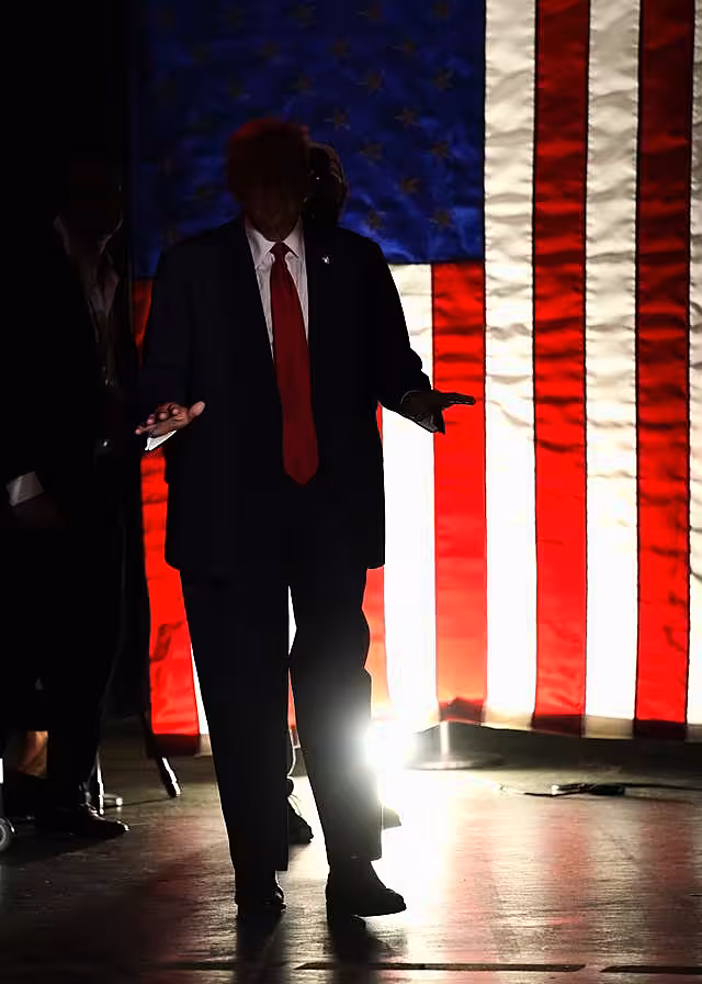 Donald Trump arrives to speak at a campaign rally at Temple University in Philadelphia