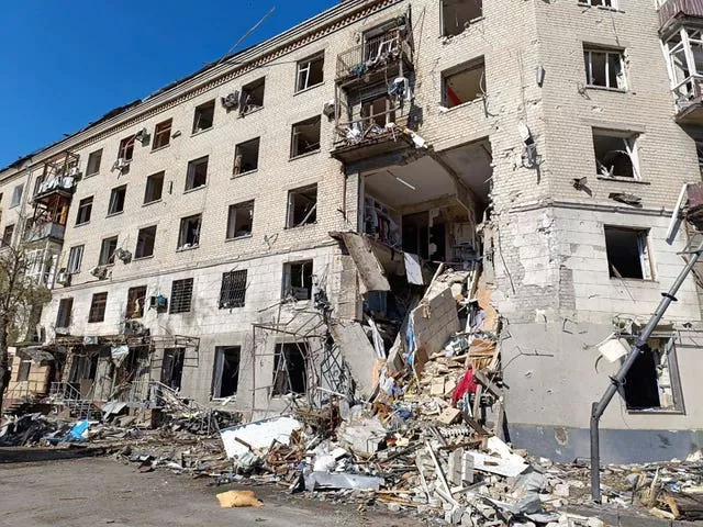 Debris lies on the ground outside a building hit by a Russian attack