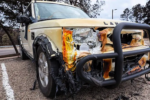 A view of the front of a vehicle that has been melted by the heat of the fire