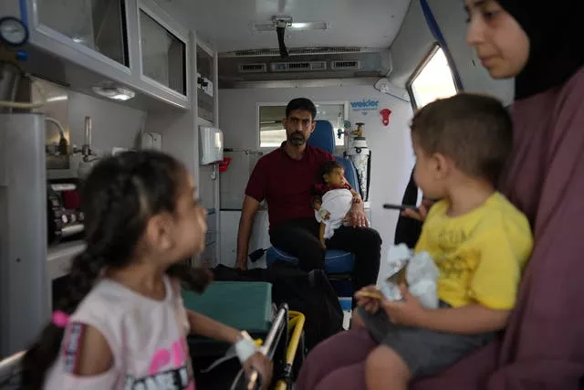 Palestinian children inside an ambulance