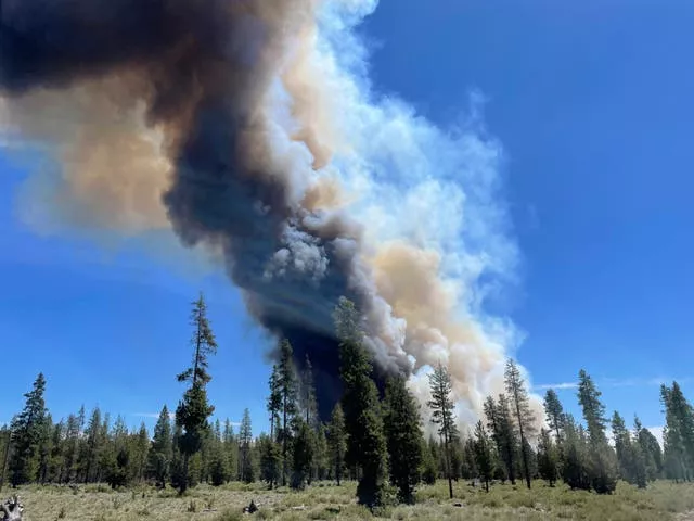 Smoke rises from a wildfire near La Pine, Oregon