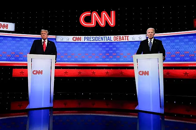 US president Joe Biden, right, and Republican presidential candidate former President Donald Trump stand during break in a presidential debate 