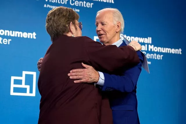 President Joe Biden hugs Sir Elton John