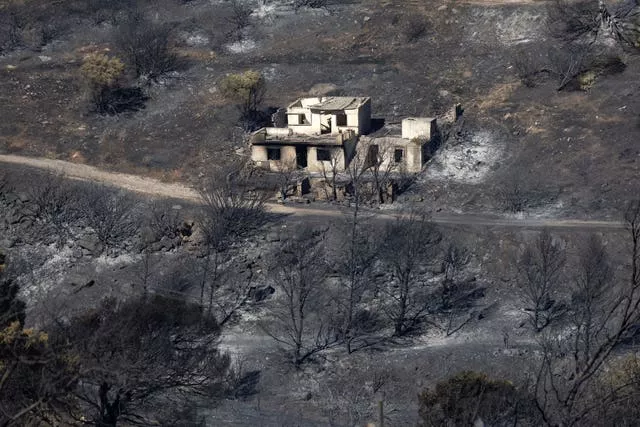 A burnt -ut house in an area of scorched earth