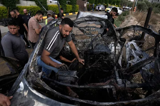 A man inside the charred car