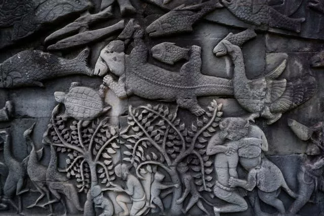 Carvings depicting crocodiles on a wall of Bayon Temple, near Cambodia’s world-famous Angkor Wat Temple in Siem Reap Province